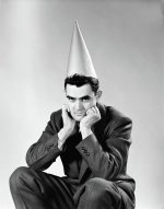 1950s-disguntled-man-wearing-dunce-cap-vintage-images.jpg